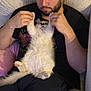Bandit Quicksilver joined the competition — help win amazing prizes! man, cat, fluffy, beard, couch, black_shirt, white_cat, indoor, relaxed, playing, pet, holding, paws_up, seated, cozy, cushion, casual, human, animal, home