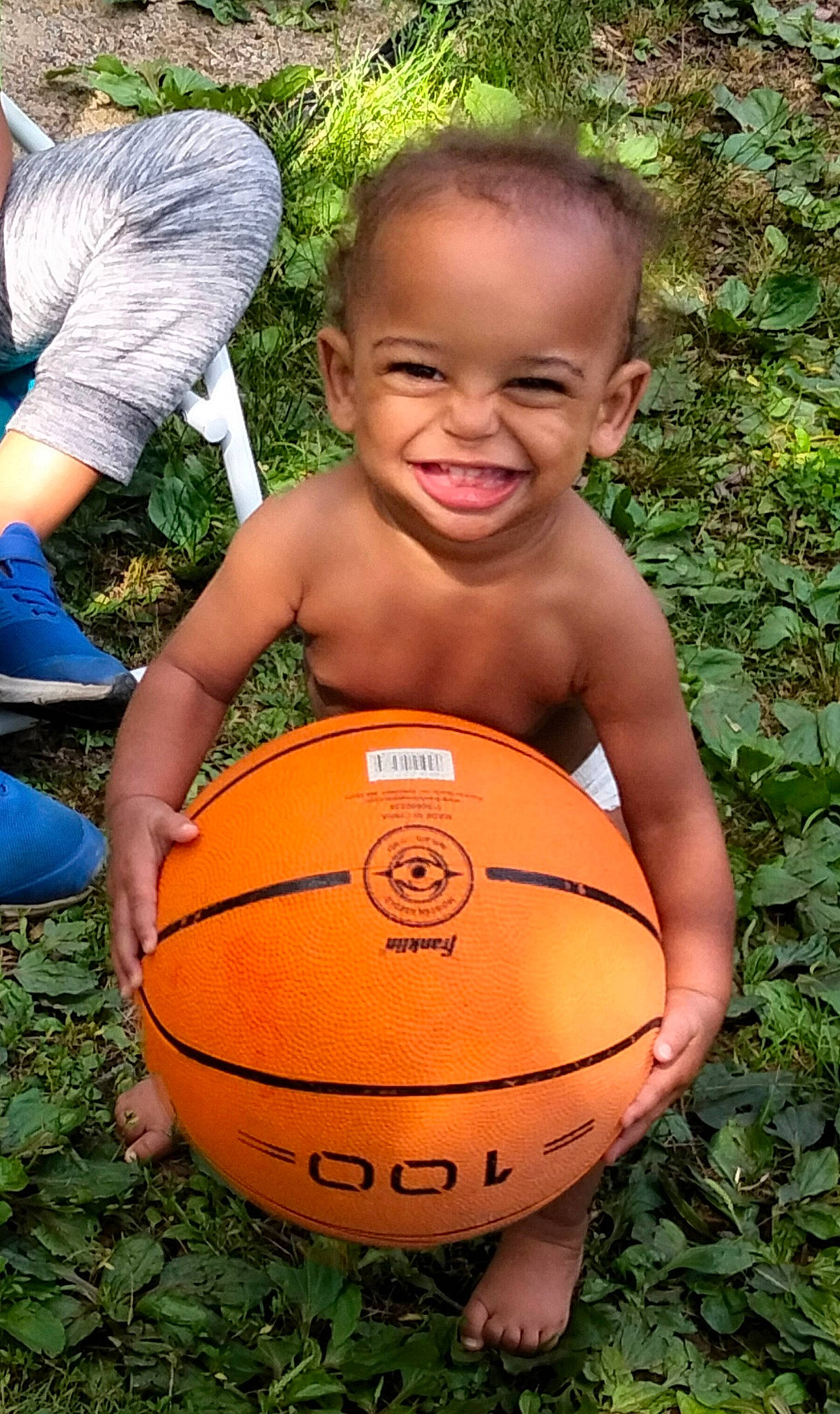 Logan joined the competition — help win amazing prizes! ball, ball_game, basketball, chest, face, fun, grass, happy, head, joy, leaf, leisure, people_in_nature, person, plant, shorts, smile, sports_equipment, sports_toy, toddler