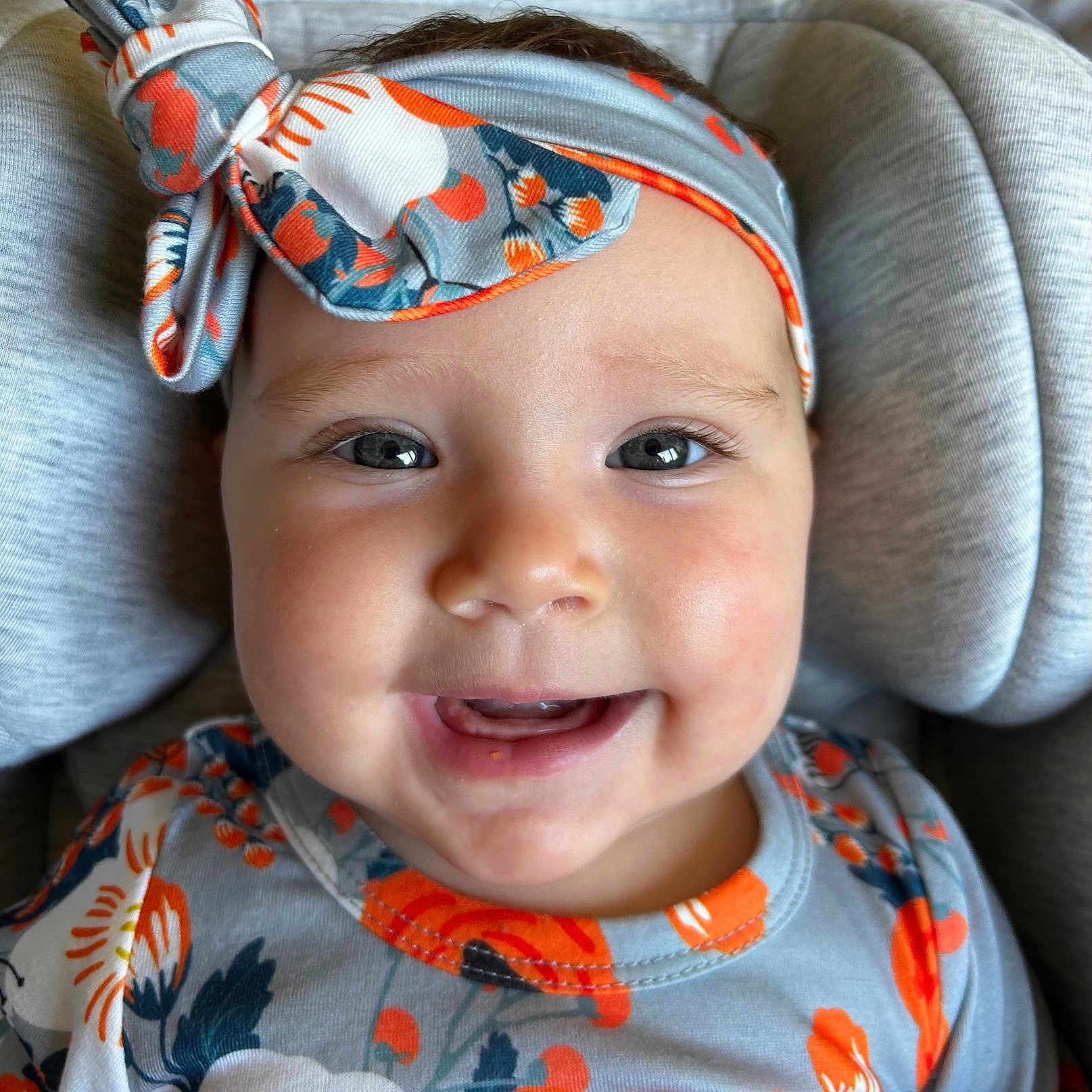 Soleil is registered to the contest to win money with this photo: accessories, baby, bodypart, clothing, couch, cushion, face, furniture, happy, hat, head, headband, homedecor, mouth, person, photography, portrait, smile, sunglasses, teeth