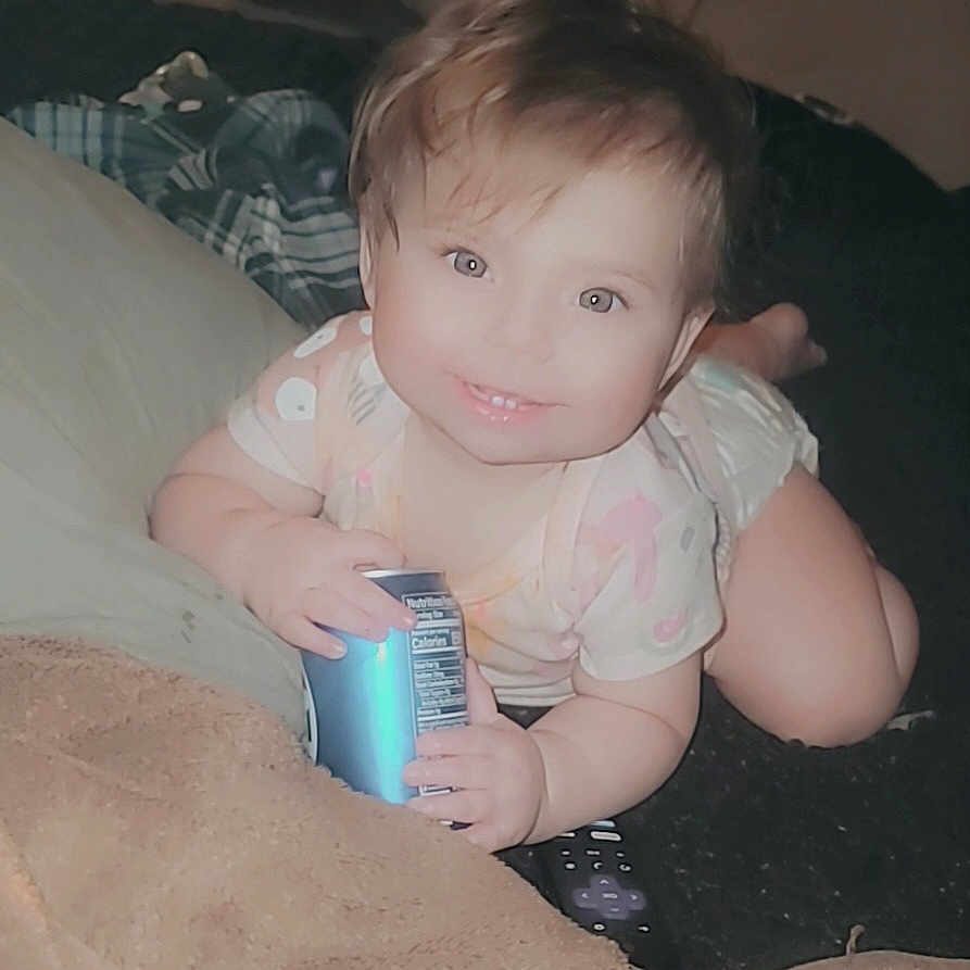 Aili is registered to the contest to win money with this photo: baby, blonde, bodypart, can, couch, crawling, cushion, face, finger, furniture, hair, hand, happy, head, homedecor, person, photography, portrait, sitting, tin