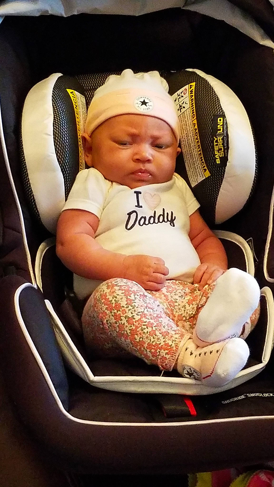 Finlay is registered to the contest to win money with this photo: car_seat, child, headgear, headwear, infant, person, product, toddler