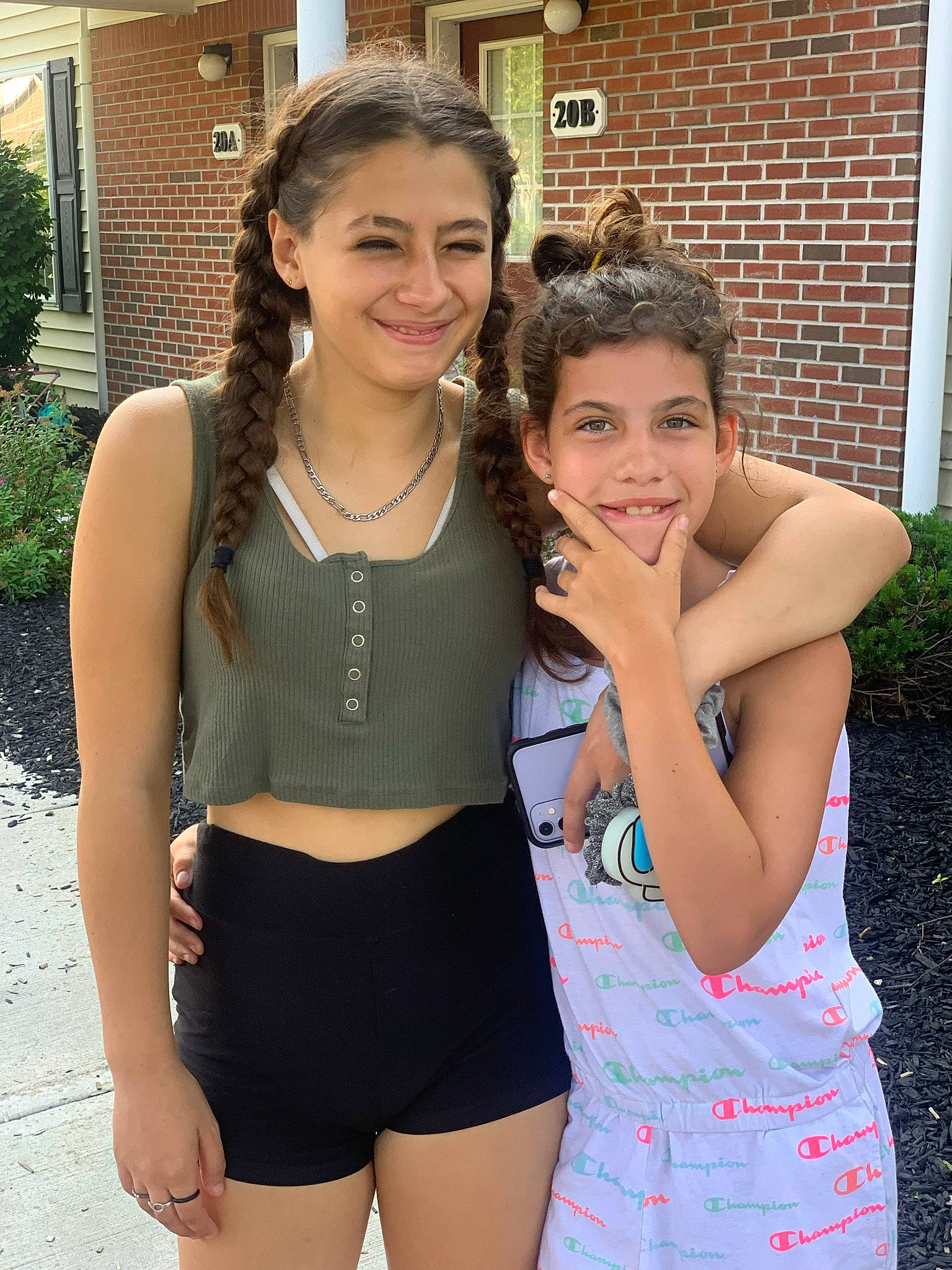 Nevaeh is registered to the contest to win money with this photo: arm, clothing, face, facial_expression, hair, hairstyle, happy, head, joy, muscle, neck, person, plant, shorts, shoulder, skin, sleeve, smile, street_fashion, thigh