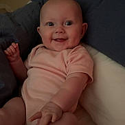 Delilah joined the competition — help win amazing prizes! baby, bed, child, comfort, cuddly, cute, face, happy, indoor, infant, onesie, person, pillow, portrait, relaxing, skin, small, smiling, soft, young