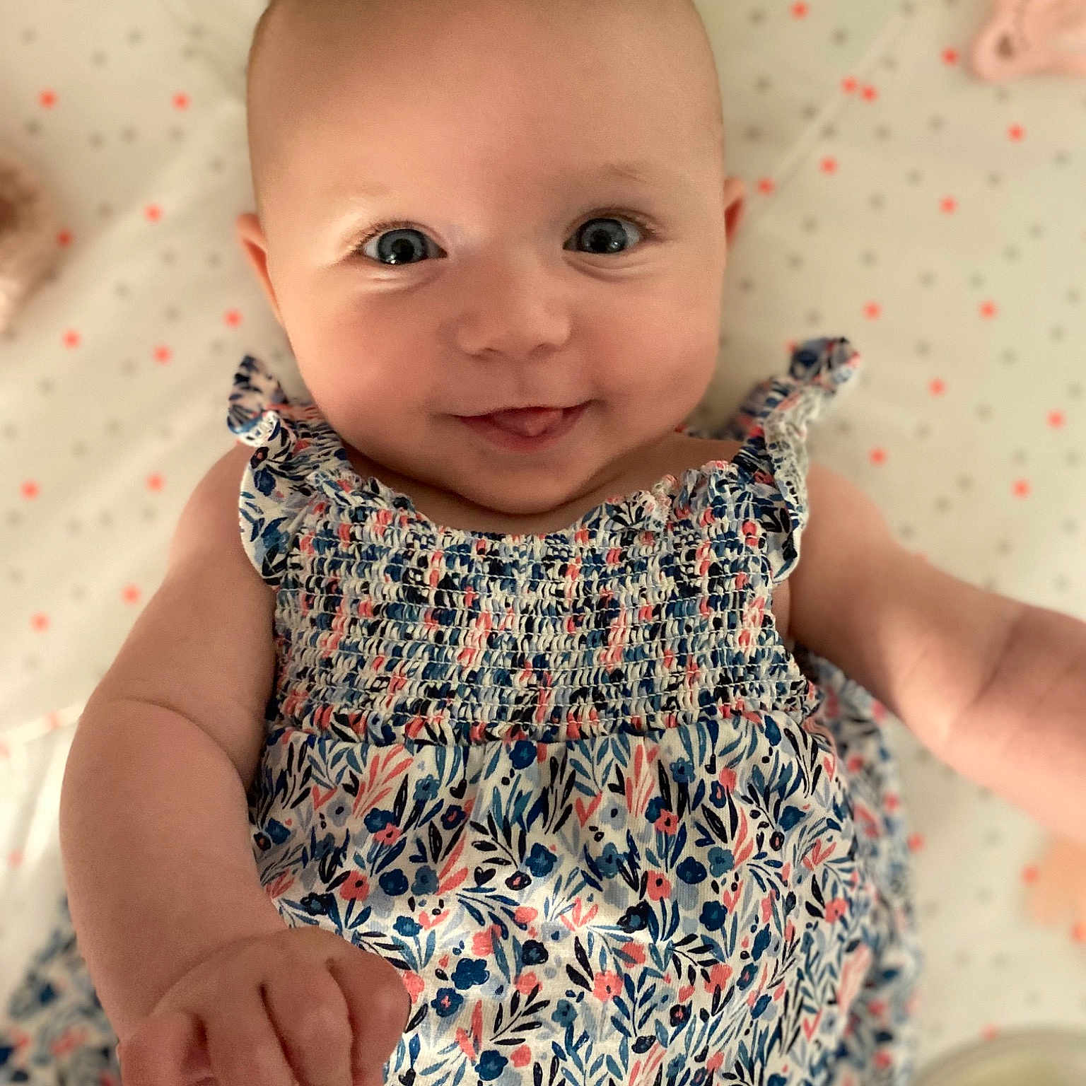 Mila participe au concours pour gagner de l'argent avec cette photo : baby, baby_toddler_clothing, collar, dress, dress_shirt, face, facial_expression, finger, gesture, happy, human, iris, lip, photograph, pink, product, skin, sleeve, smile, white