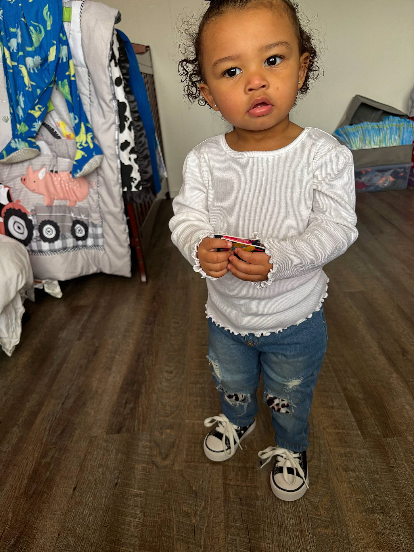 Aliyah joined the competition — help win amazing prizes! baby, bodypart, clothing, couch, face, finger, footwear, furniture, hand, hardwood, head, jeans, longsleeve, pants, person, photography, shoe, sitting, sleeve, wood