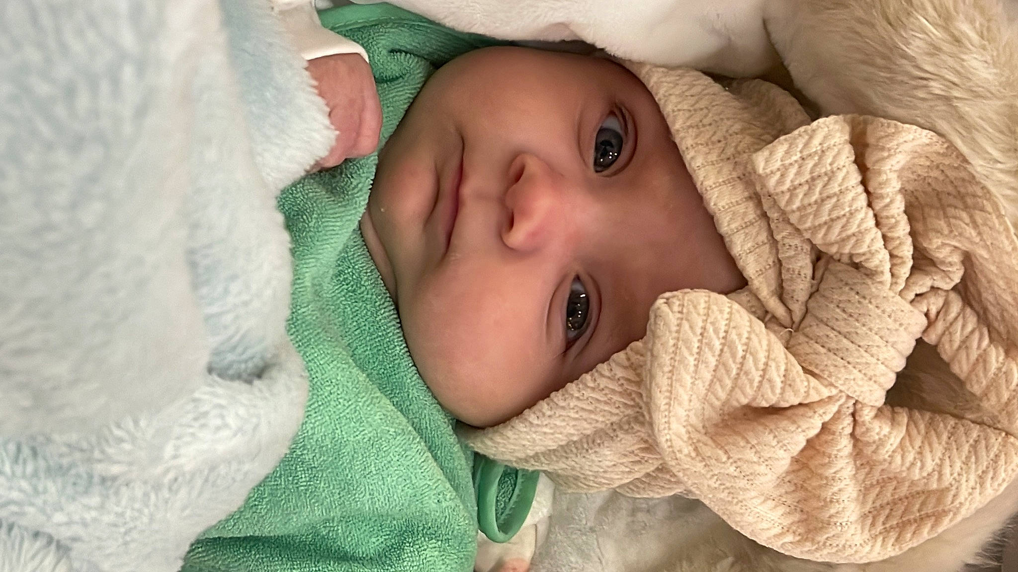 Miriam is registered to the contest to win money with this photo: baby, baby_toddler_clothing, cheek, child, chin, comfort, eye, eyebrow, eyelash, face, grass, head, headwear, human_body, iris, lip, mouth, nose, person, skin