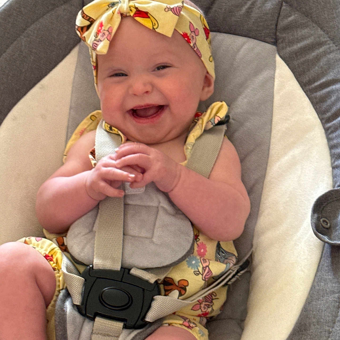 Amelia is registered to the contest to win money with this photo: accessories, baby, bed, bodypart, bonnet, car, car_interior, clothing, face, finger, furniture, hand, hat, head, person, photography, portrait, strap, transportation, vehicle