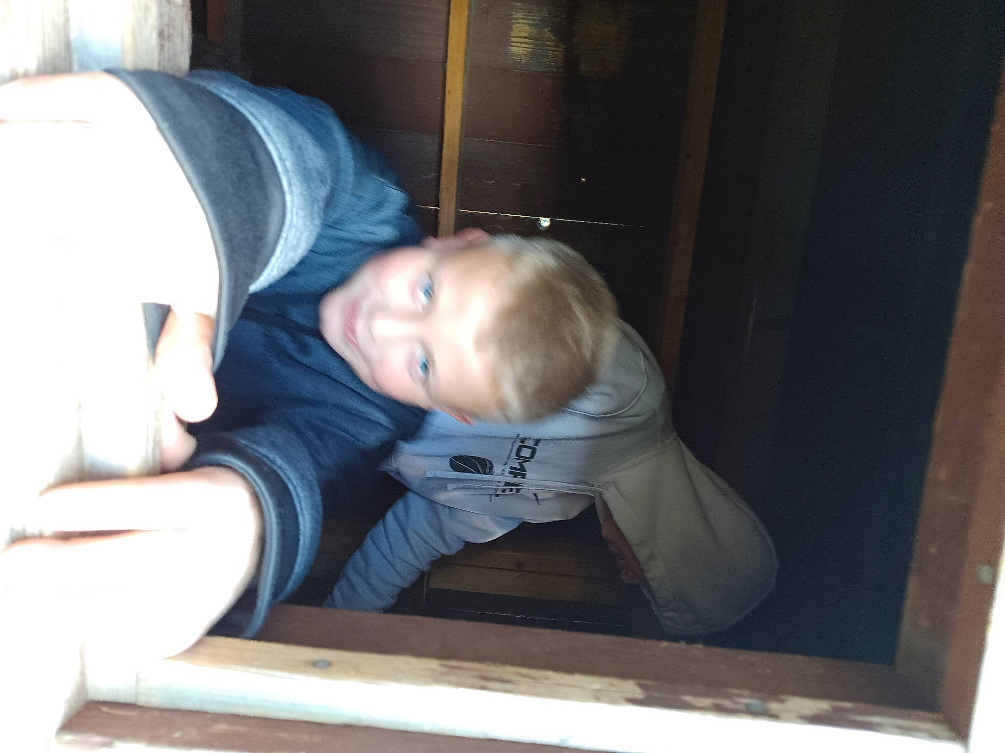 Jayden is registered to the contest to win money with this photo: baby, baby_toddler_clothing, cheek, child, comfort, fun, hat, person, sitting, sleeve, smile, t_shirt, toddler, window, wood