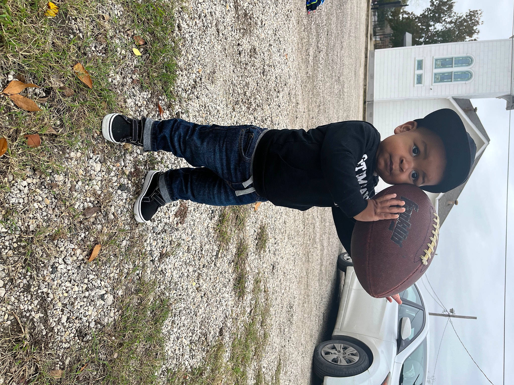 Kylen is registered to the contest to win money with this photo: asphalt, automotive_exterior, automotive_lighting, automotive_tire, automotive_wheel_system, car, family_car, fun, hat, motor_vehicle, person, rolling, shadow, sneakers, sun_hat, tire, toddler, vehicle, vehicle_door, walking_shoe