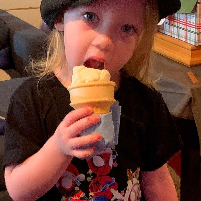 Willow joined the competition — help win amazing prizes! baseballcap, cap, child, clothing, couch, cream, dessert, eating, face, female, food, furniture, girl, hat, head, icecream, person, photography, portrait, t_shirt