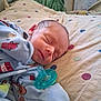 Jared is registered to the contest to win money with this photo: adorable, baby, bed, blanket, child, clothing, cute, face, head, indoors, infant, newborn, onesie, pacifier, peaceful, polka_dot, resting, sleeping, small, soft
