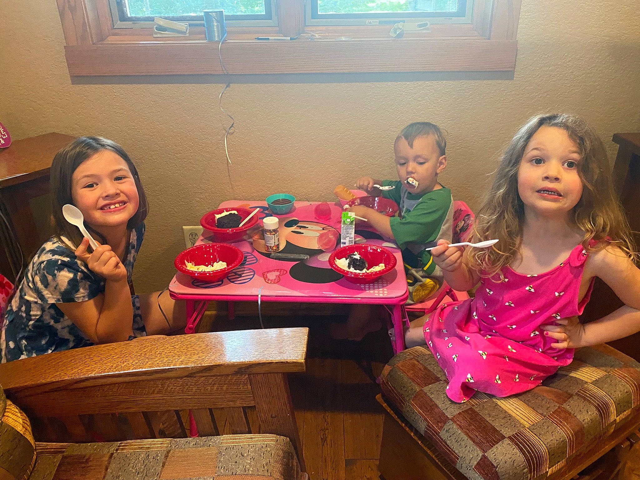 Bowen is registered to the contest to win money with this photo: chair, child, dress, event, food, fun, furniture, happy, holiday, joy, leisure, party, person, picture_frame, plate, sharing, sitting, smile, surprise, table