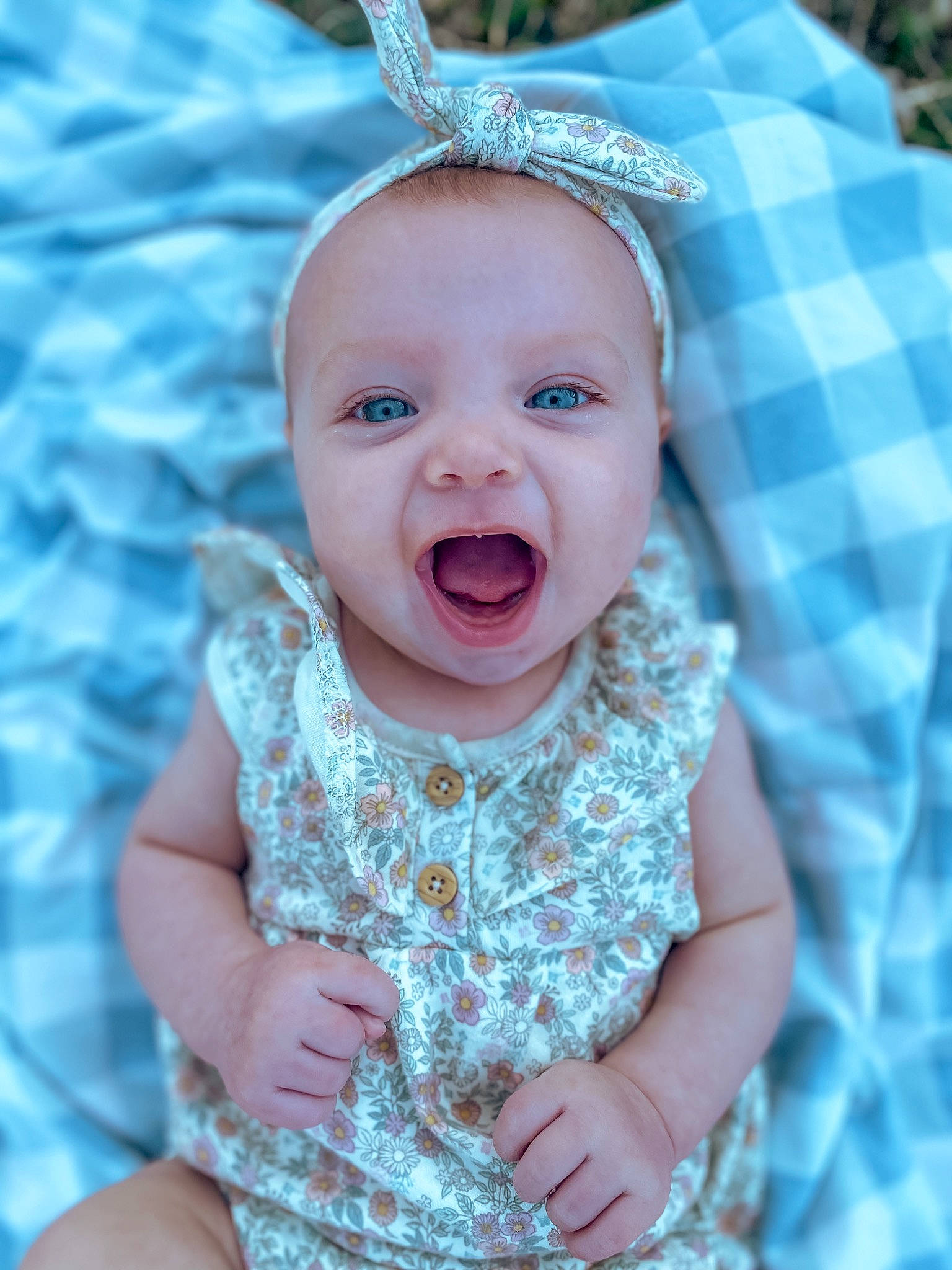 Andi joined the competition — help win amazing prizes! aqua, azure, baby, baby_toddler_clothing, blue, child, fashion_accessory, fun, gesture, grass, happy, head, iris, pattern, person, pink, skin, sleeve, smile, textile