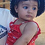 adult, baby, casual, child, clothing, curious, expression, eyes, face, floral_pattern, hat, holding, outdoor, person, portrait, red_dress, skin, summer, toddler, young_child