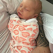 Willow joined the competition — help win amazing prizes! baby, newborn, infant, sleeping, swaddle, blanket, heart_pattern, pink, closeup, portrait, sleeping_baby, arm, tattooed_arm, parent, holding, peaceful, nursery, skin, lips, eyelashes