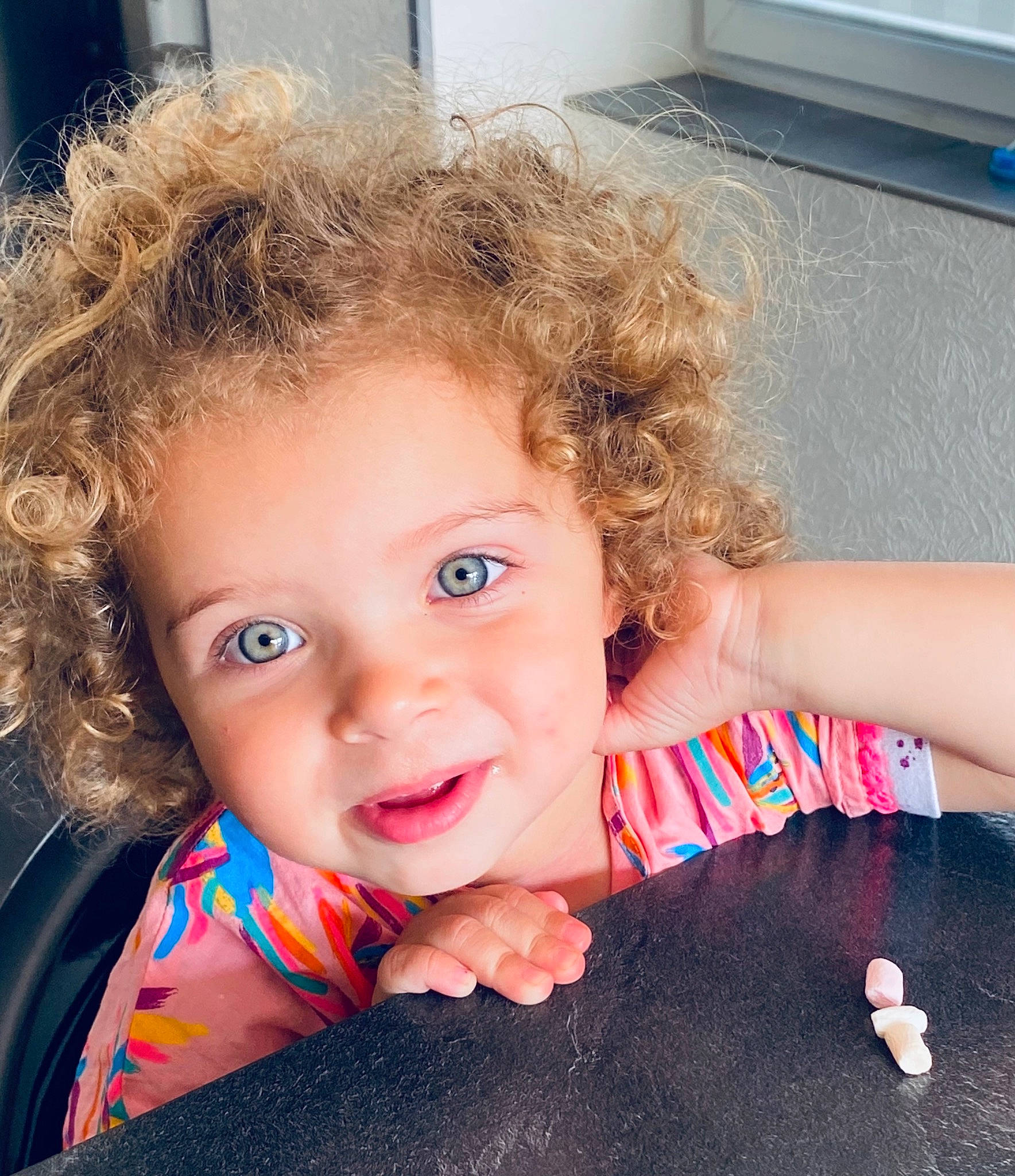 élyna participe au concours pour gagner de l'argent avec cette photo : arm, baby, baby_toddler_clothing, blue, brown_hair, cheek, chin, ear, eyelash, finger, flash_photography, flooring, gesture, happy, iris, joy, lip, mouth, nose, person