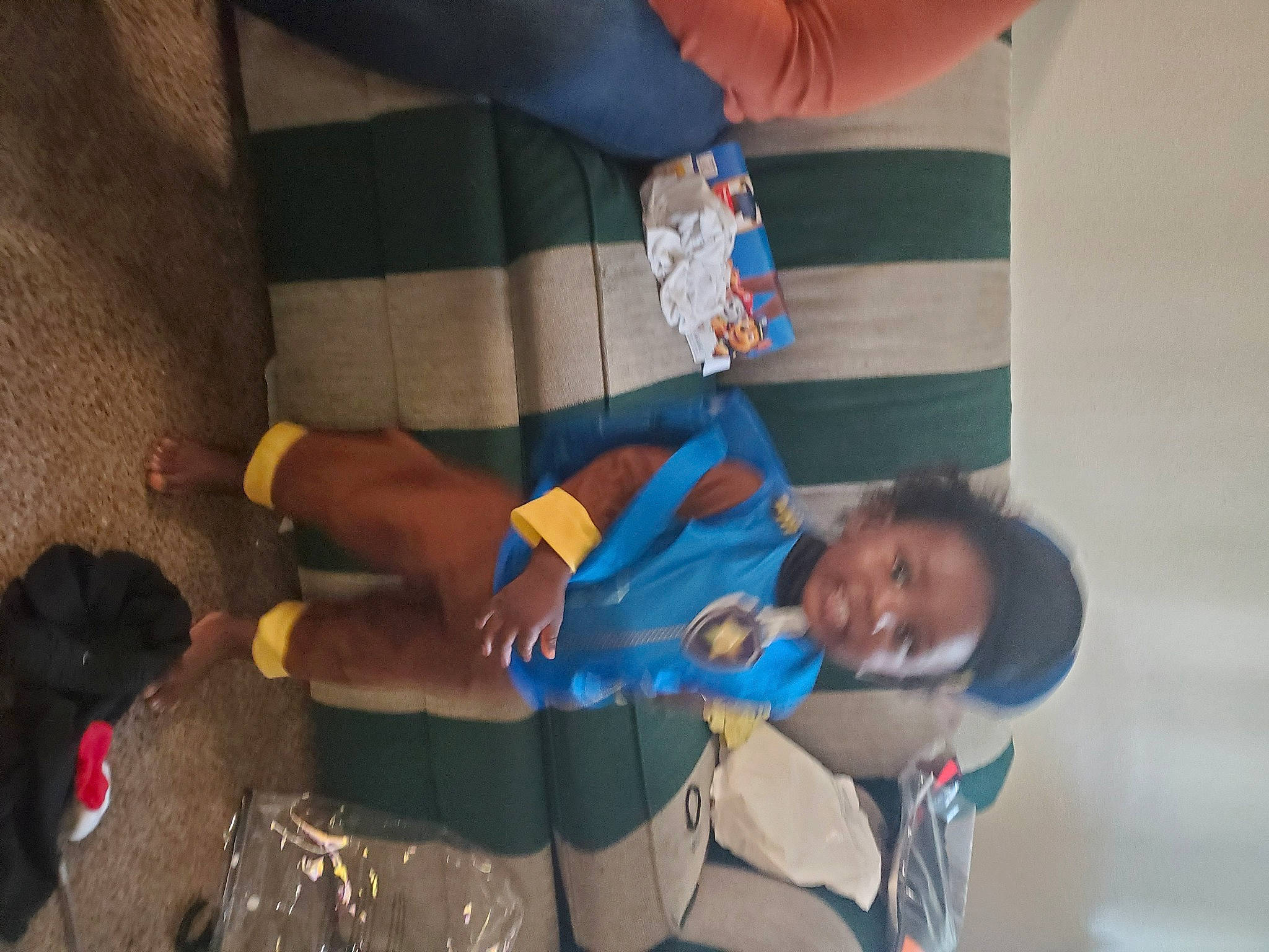 Zymir is registered to the contest to win money with this photo: arm, child, clothing, elbow, electric_blue, foot, fun, human_leg, knee, leisure, mouth, nail, person, room, sandal, shorts, smile, thigh, toddler, tree