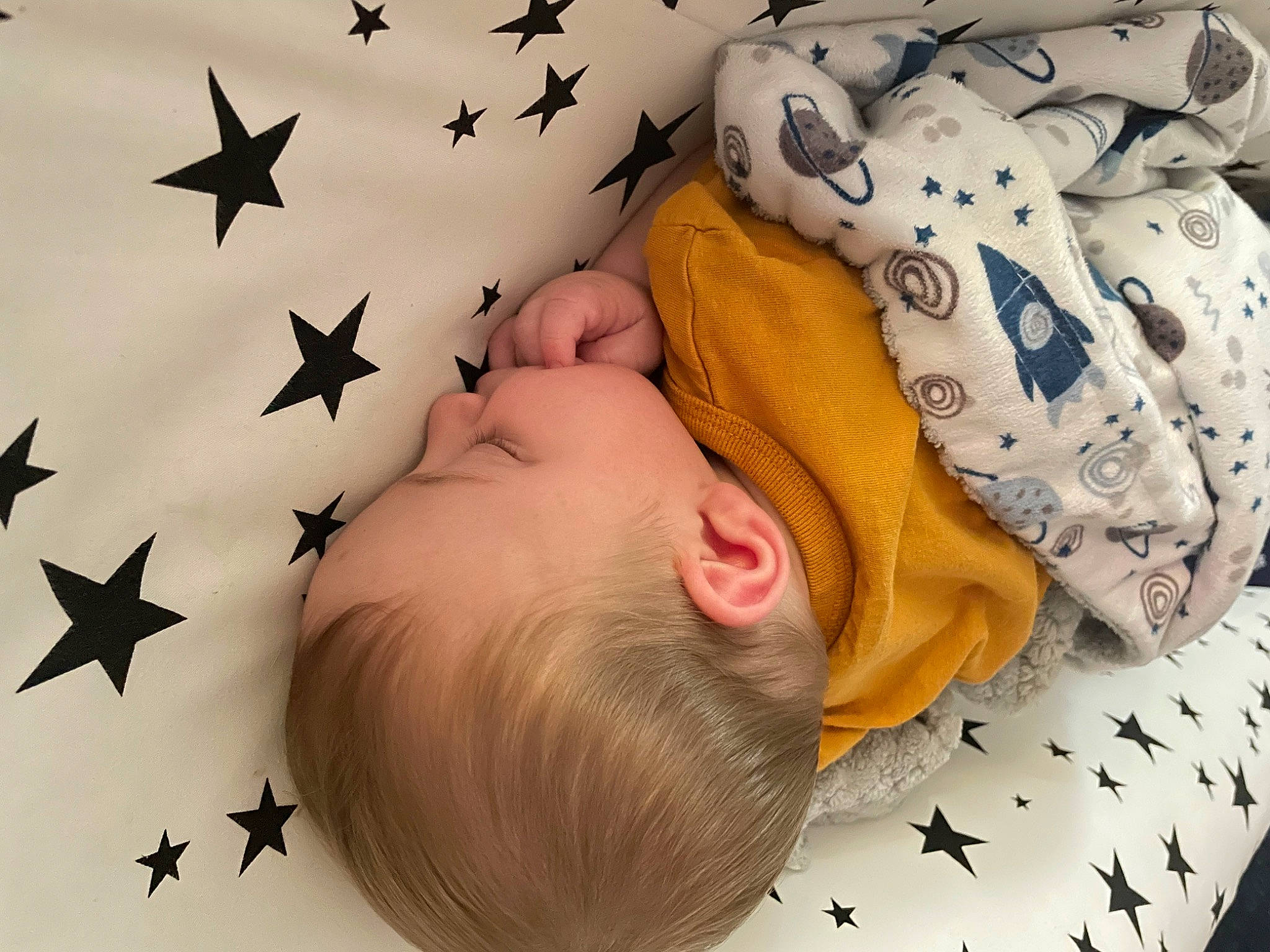 Niko is registered to the contest to win money with this photo: baby, baby_sleeping, baby_toddler_clothing, child, comfort, event, facial_expression, finger, gesture, happy, holiday, linens, nail, ornament, party_supply, pattern, people, person, product, star
