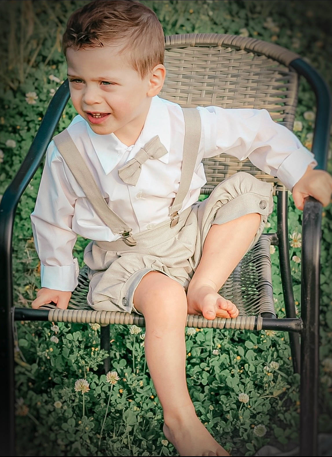 Dean is registered to the contest to win money with this photo: baby_toddler_clothing, blond, chair, child, dress, finger, flash_photography, fun, grass, happy, joy, leg, leisure, muscle, pattern, people_in_nature, person, plant, sitting, skin
