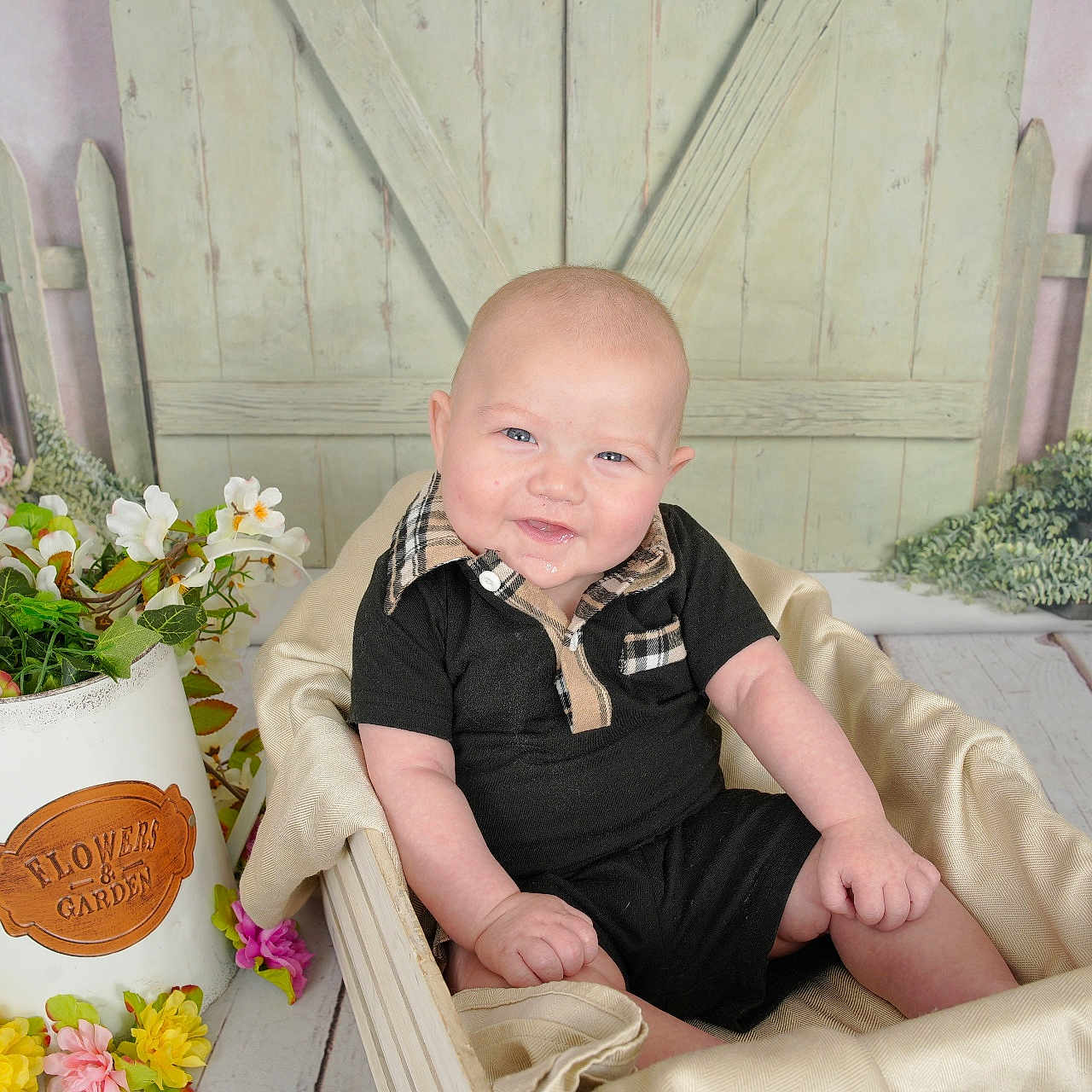 Kuon joined the competition — help win amazing prizes! baby, smile, black_clothing, basket, flower_pot, flowers, wooden_floor, wooden_door, picket_fence, greenery, indoor, portrait, cute, infant, cushion, decor, happy, sitting, plush, background