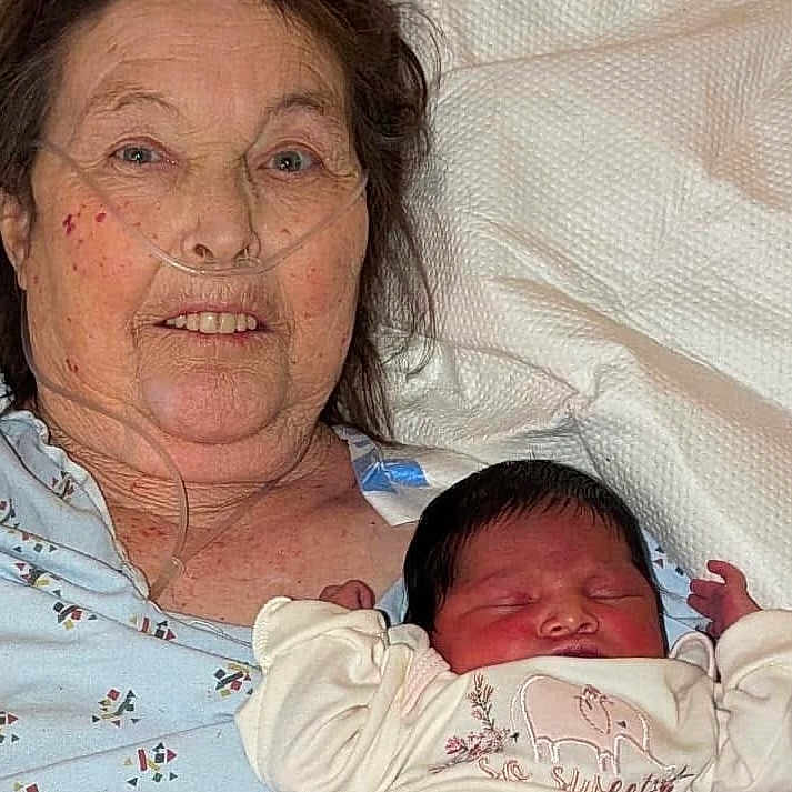 Katerina joined the competition — help win amazing prizes! bed, blanket, clothing, elderly_woman, face, family, healthcare, hospital_gown, indoor, infant, love, newborn, newborn_baby, oxygen_tube, person, portrait, rest, skin, sleeping, woman