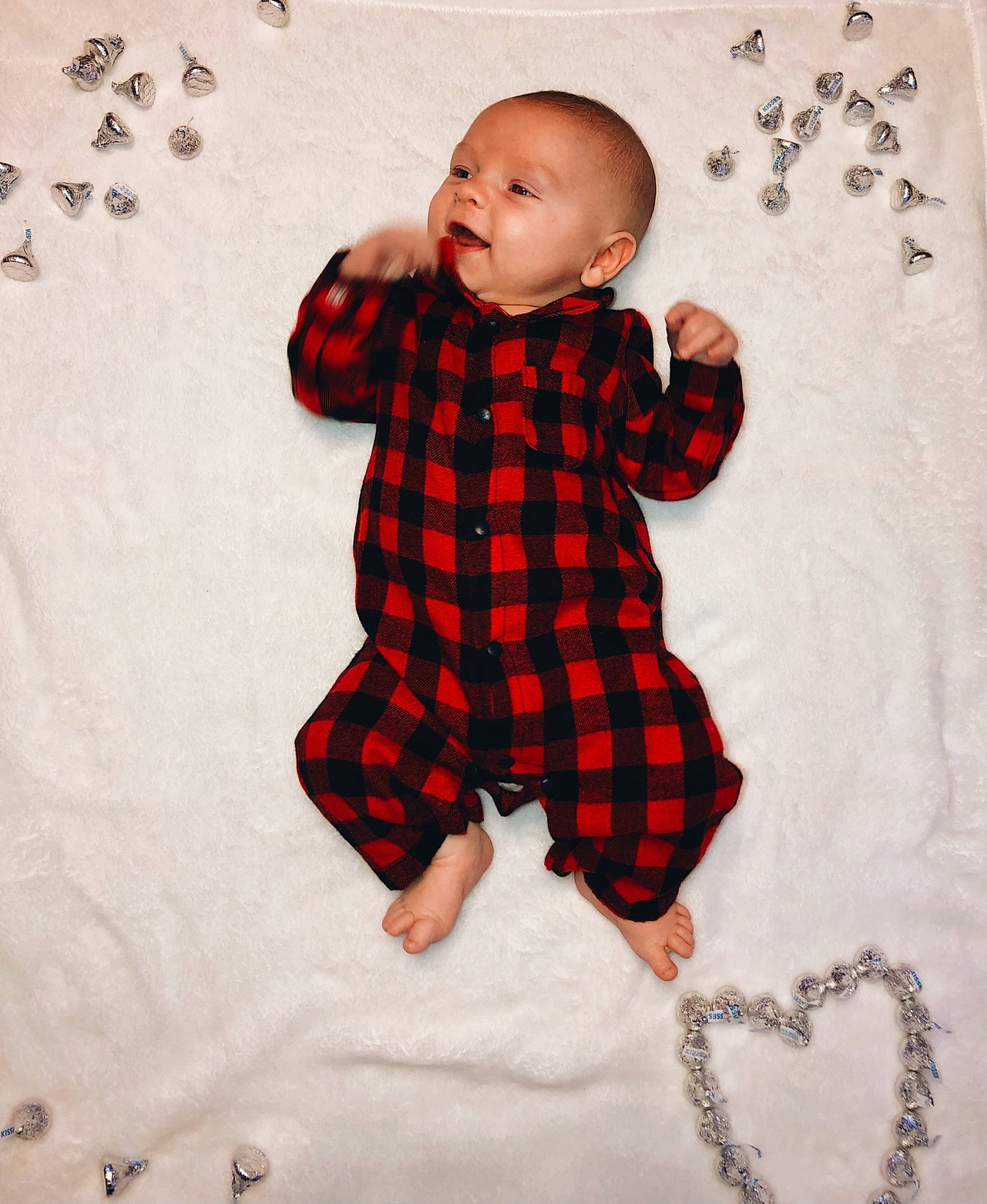 Jase is registered to the contest to win money with this photo: arm, art, baby, baby_toddler_clothing, child, collar, face, gesture, happy, head, human_body, illustration, linens, pattern, person, plaid, sleeve, t_shirt, tartan, textile