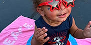 Meeko is registered to the contest to win money with this photo: asphalt, barefoot, blue, casual_clothing, child, happy, outdoor, person, pink, playing, red_shorts, smiling, star_shaped, summer, sunglasses, tank_top, toddler, towel, two_children, yellow_curb