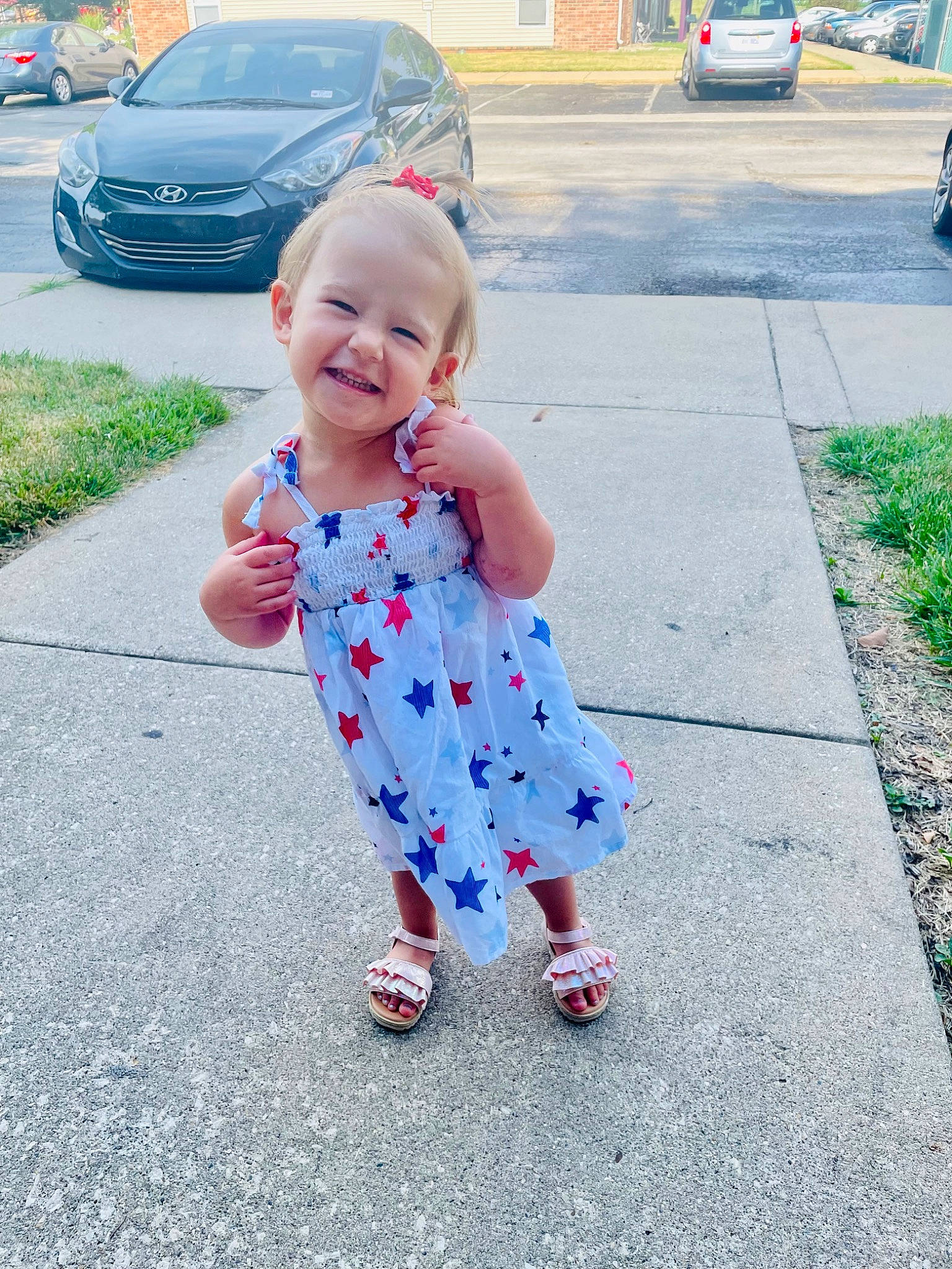Saige joined the competition — help win amazing prizes! asphalt, automotive_tire, baby_toddler_clothing, car, child, electric_blue, fun, grass, happy, joy, leisure, person, photograph, pink, plant, recreation, road_surface, smile, snapshot, tire