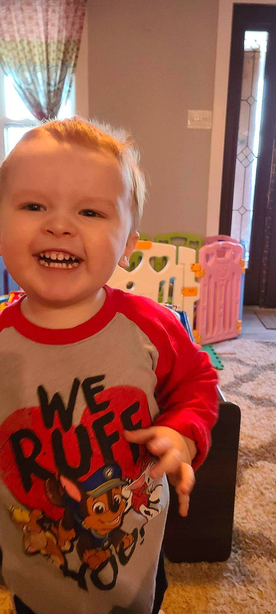 Charlie is registered to the contest to win money with this photo: baby, baby_toddler_clothing, chair, cheek, child, chin, door, fun, happy, head, joy, orange, pattern, person, play, room, sitting, sleeve, smile, t_shirt