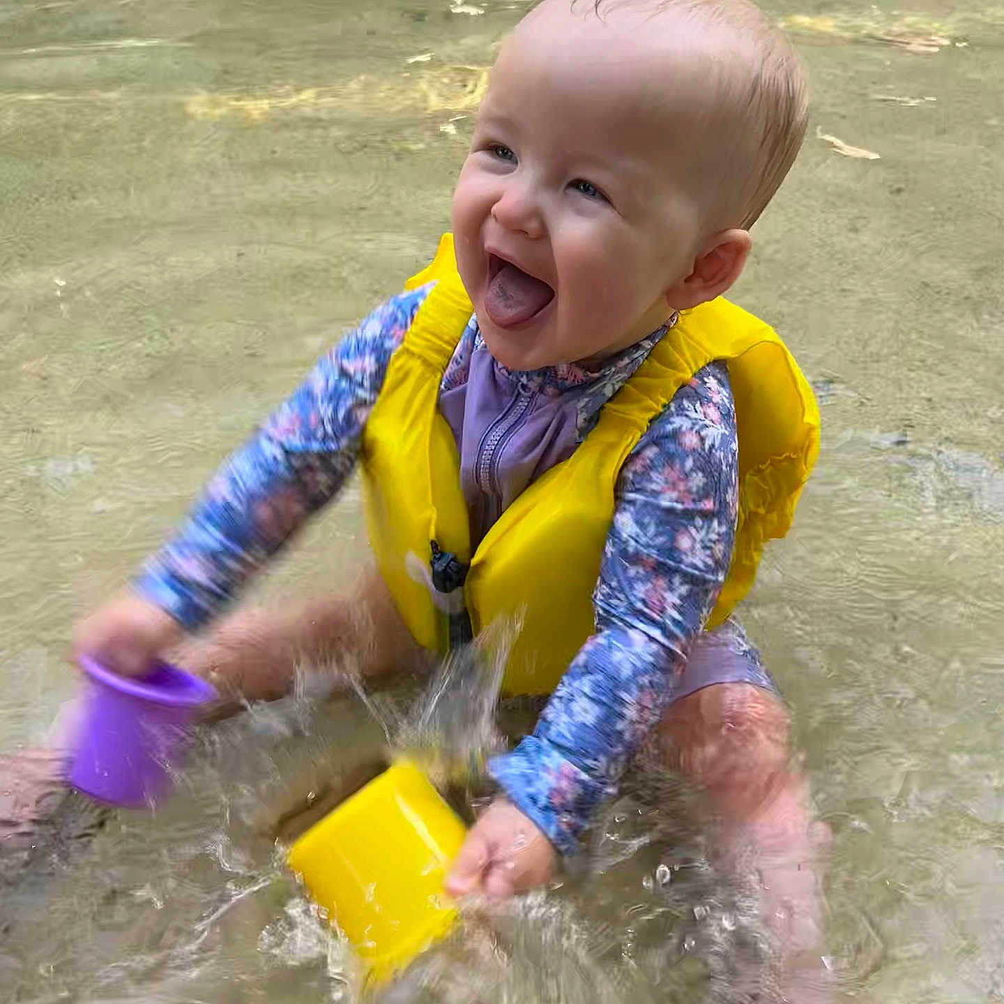 Ottilie is registered to the contest to win money with this photo: baby, babylaughing, bathing, clothing, face, happy, head, laughing, leisureactivities, lifejacket, person, photography, portrait, sitting, smile, sport, swimming, vest, water, watersports