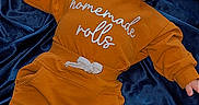 Kreminz joined the competition — help win amazing prizes! baby, infant, child, orange_outfit, homemade_rolls, lying_down, navy_blue_blanket, cozy_clothing, socks, cute, portrait, indoors, soft_texture, pout, expression, face, head, hands, feet, comfortable