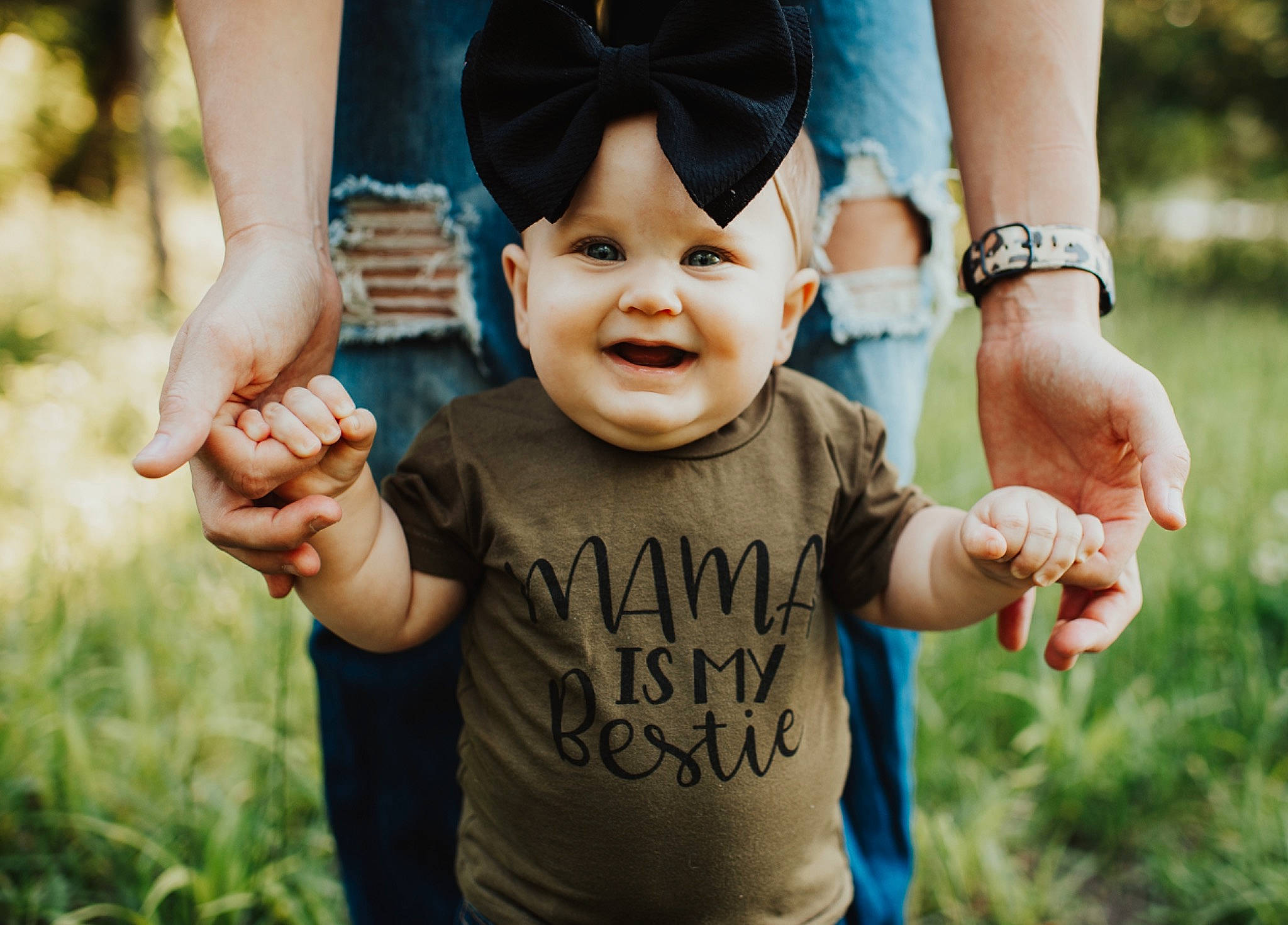 Baker is registered to the contest to win money with this photo: adaptation, baby, child, finger, fun, gesture, grass, hand, happy, joy, people, people_in_nature, person, photograph, photography, plant, play, smile, thumb, toddler