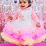 toddler, child, smiling, dress, pink, yellow, white, bow, pearls, party, celebration, festive, background, sparkles, happy, standing, cute, accessories, indoors, portrait