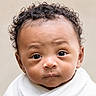 adorable, baby, child, close_up, curious, curly_hair, cute, expression, eyes, face, head, infant, looking, newborn, person, portrait, skin, white_blanket, wrapped, young