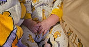 Calliope joined the competition — help win amazing prizes! baby, infant, child, pacifier, couch, blanket, pillow, pajamas, sleepwear, sitting, lying_down, portrait, face, eyes, indoors, home, soft_furnishings, plush_toy, cozy, photograph