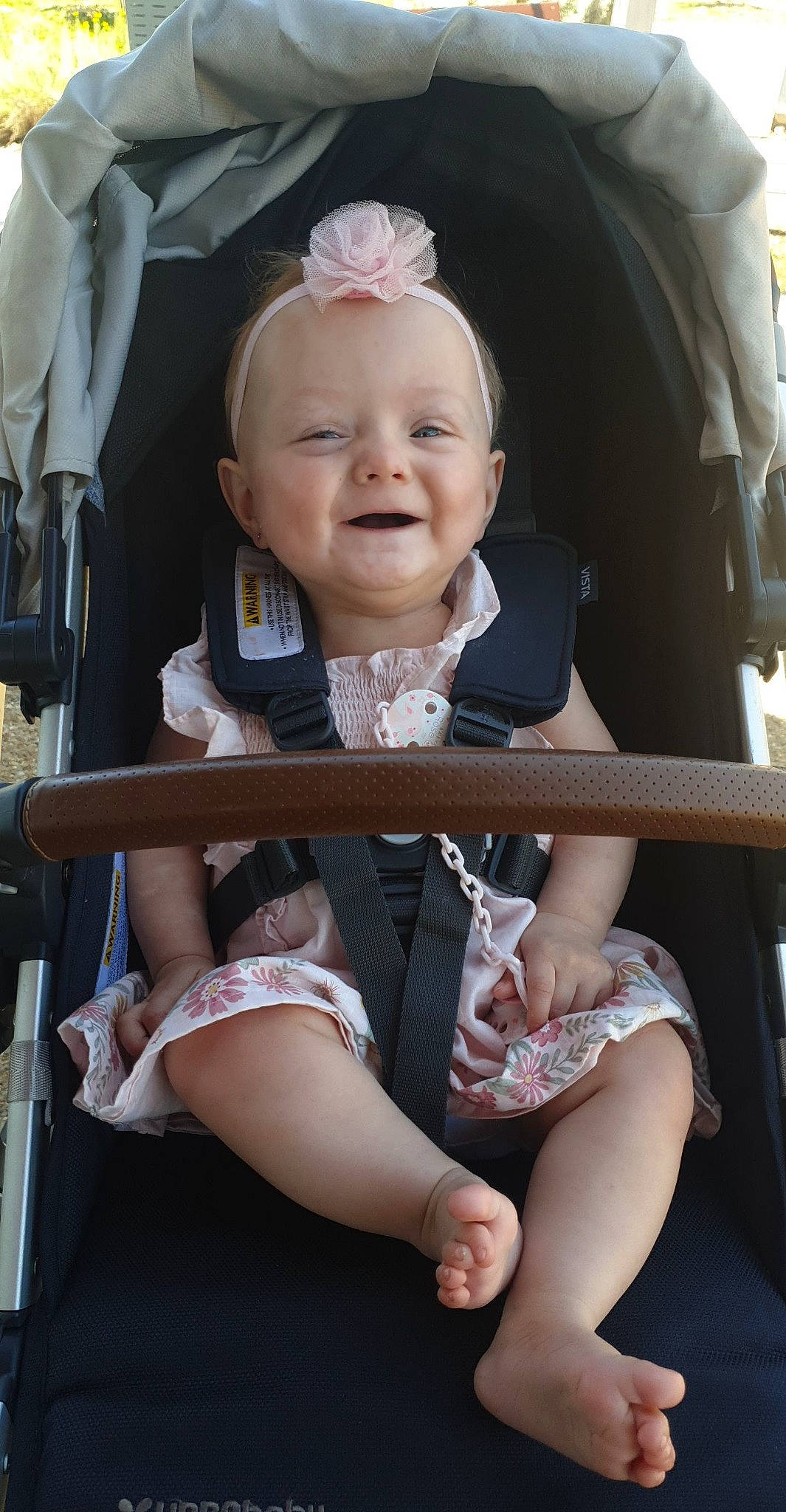 Skyla joined the competition — help win amazing prizes! baby, baby_carriage, baby_toddler_clothing, beauty, chair, cheek, child, comfort, facial_expression, fashion, fun, happy, human, person, pink, product, skin, smile, snapshot, thigh