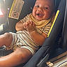 baby, child, car_seat, smiling, sunglasses, striped_clothing, bib, hands, seatbelt, infant, cute, happy, portrait, indoor, person, seat, accessory, clothing, face, baby_toddler