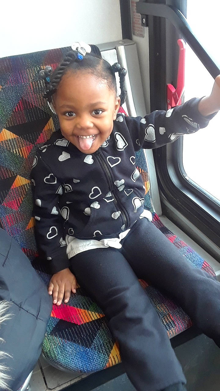 Nia joined the competition — help win amazing prizes! auto_part, car_seat, child, joy, person, steering_wheel, toddler