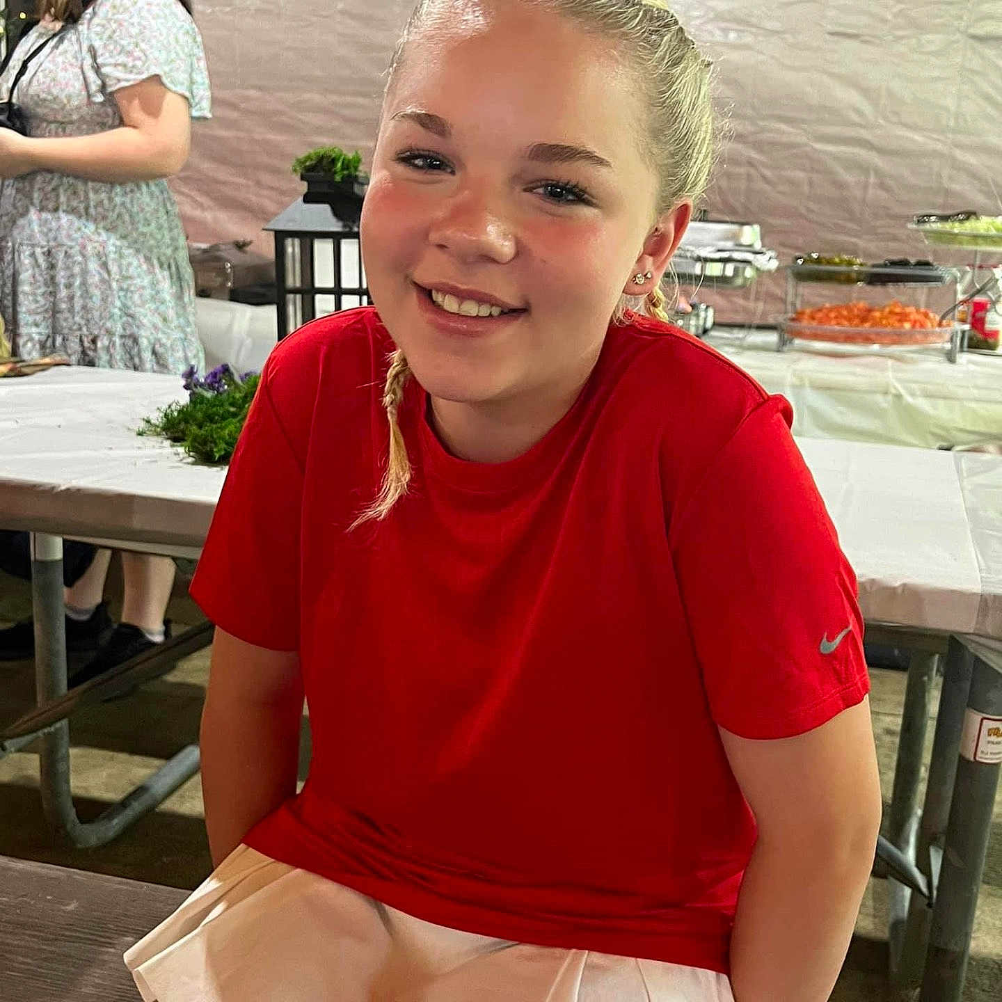 Layla joined the competition — help win amazing prizes! accessories, adult, blonde, clothing, dimples, face, female, footwear, glasses, hair, happy, head, person, photobombing, racket, shoe, skirt, sleeve, smile, woman