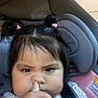 toddler, child, car_seat, face, finger, nose, hair, pigtails, clothing, seatbelt, infant, baby, expression, indoor, closeup, person, cute, funny, portrait, young