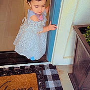 Rubab is registered to the contest to win money with this photo: child, clothing, door, doormat, dress, face, female, footwear, girl, head, jar, mat, pants, person, photography, plant, portrait, pottedplant, sandal, shoe