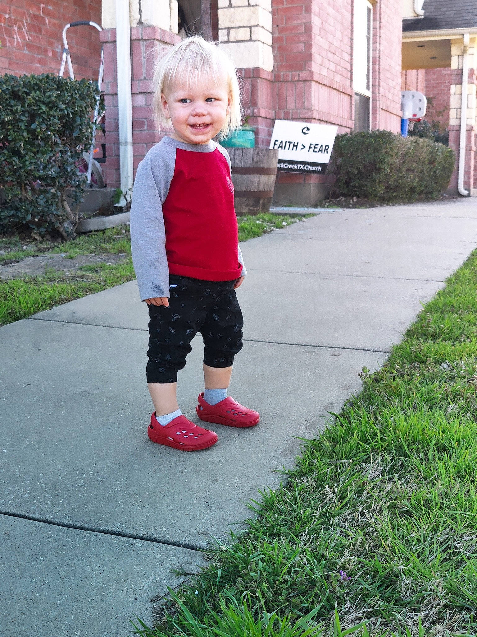 Beaux is registered to the contest to win money with this photo: asphalt, baby, baby_toddler_clothing, child, fun, grass, joy, lawn, leisure, pattern, people_in_nature, person, plant, recreation, road_surface, shrub, sidewalk, smile, snapshot, sports_equipment