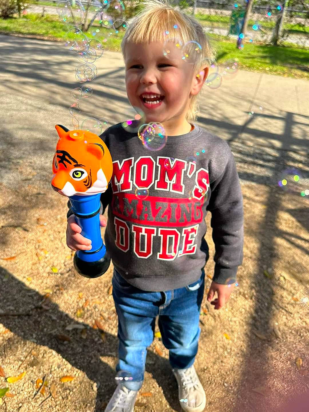 Jrue is registered to the contest to win money with this photo: baby, baby_toddler_clothing, child, cool, electric_blue, finger, fun, grass, happy, leisure, people_in_nature, person, plant, play, recreation, sleeve, smile, t_shirt, toddler, toy