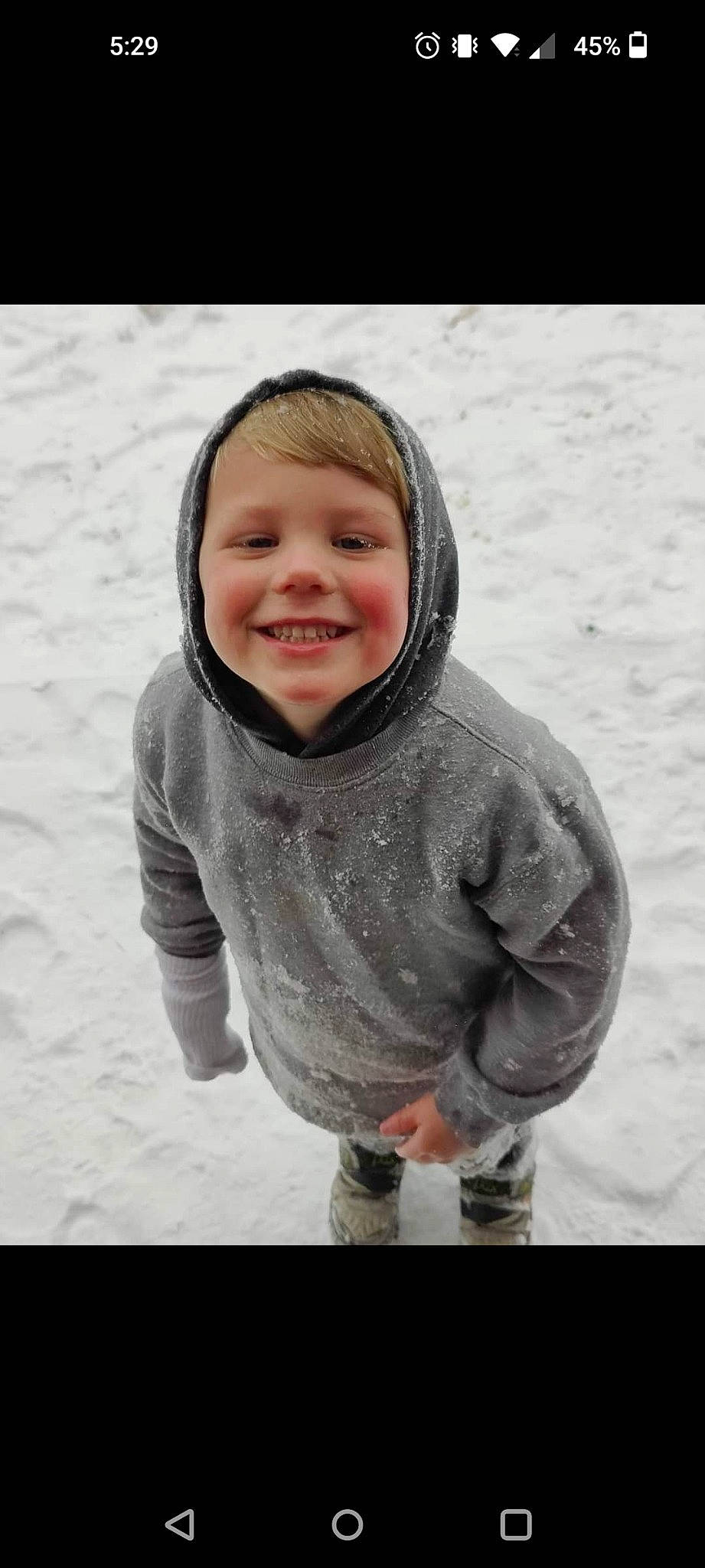 Royce is registered to the contest to win money with this photo: child, face, flash_photography, freezing, fun, gesture, hair, happy, head, headwear, human_body, joy, monochrome, monochrome_photography, nose, outerwear, people_in_nature, person, sand, sleeve