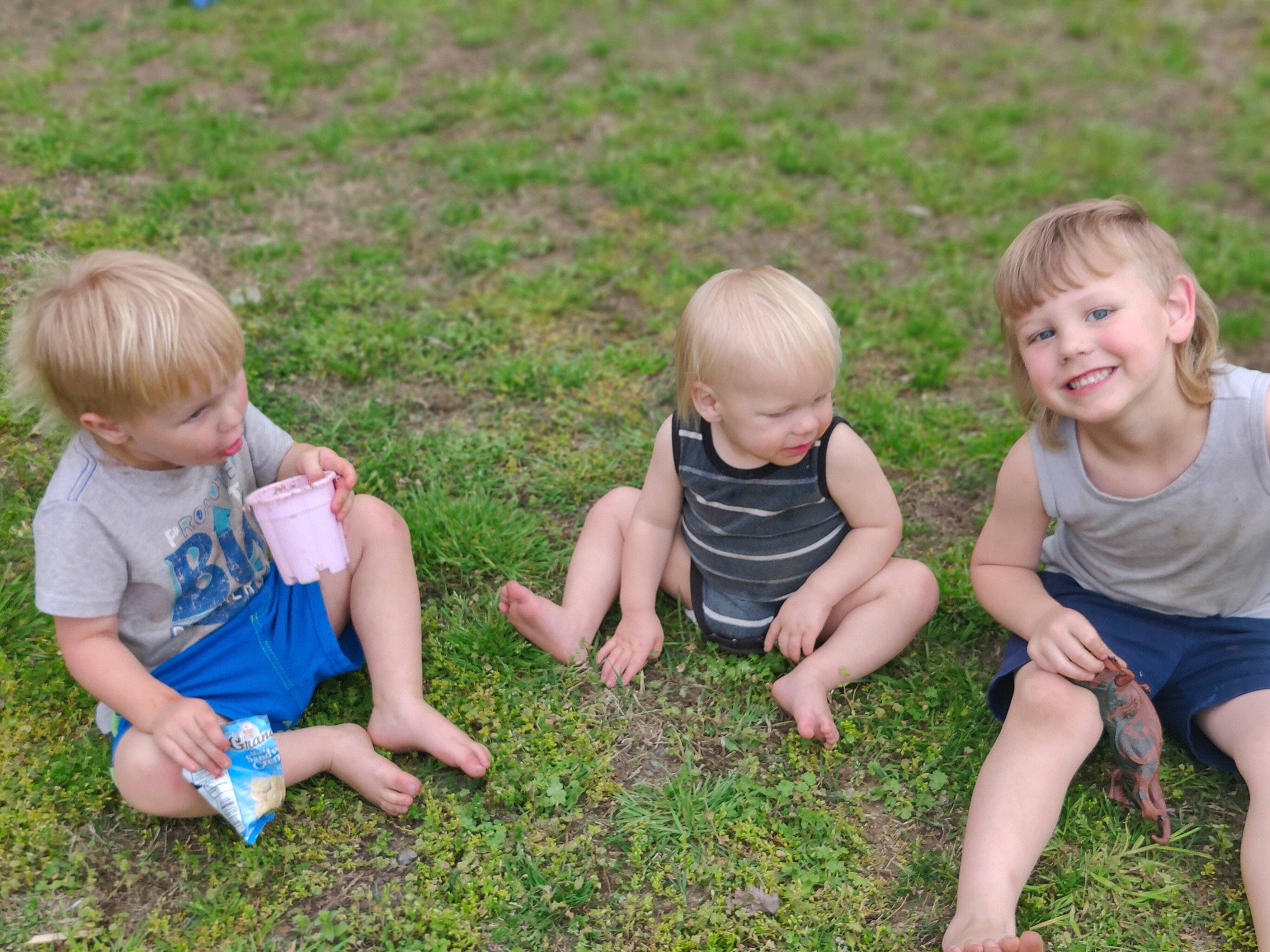 Royce is registered to the contest to win money with this photo: baby, baby_toddler_clothing, child, event, fun, grass, grass_family, grassland, happy, joy, lawn, leisure, people_in_nature, person, plant, sharing, shorts, sitting, smile, soil