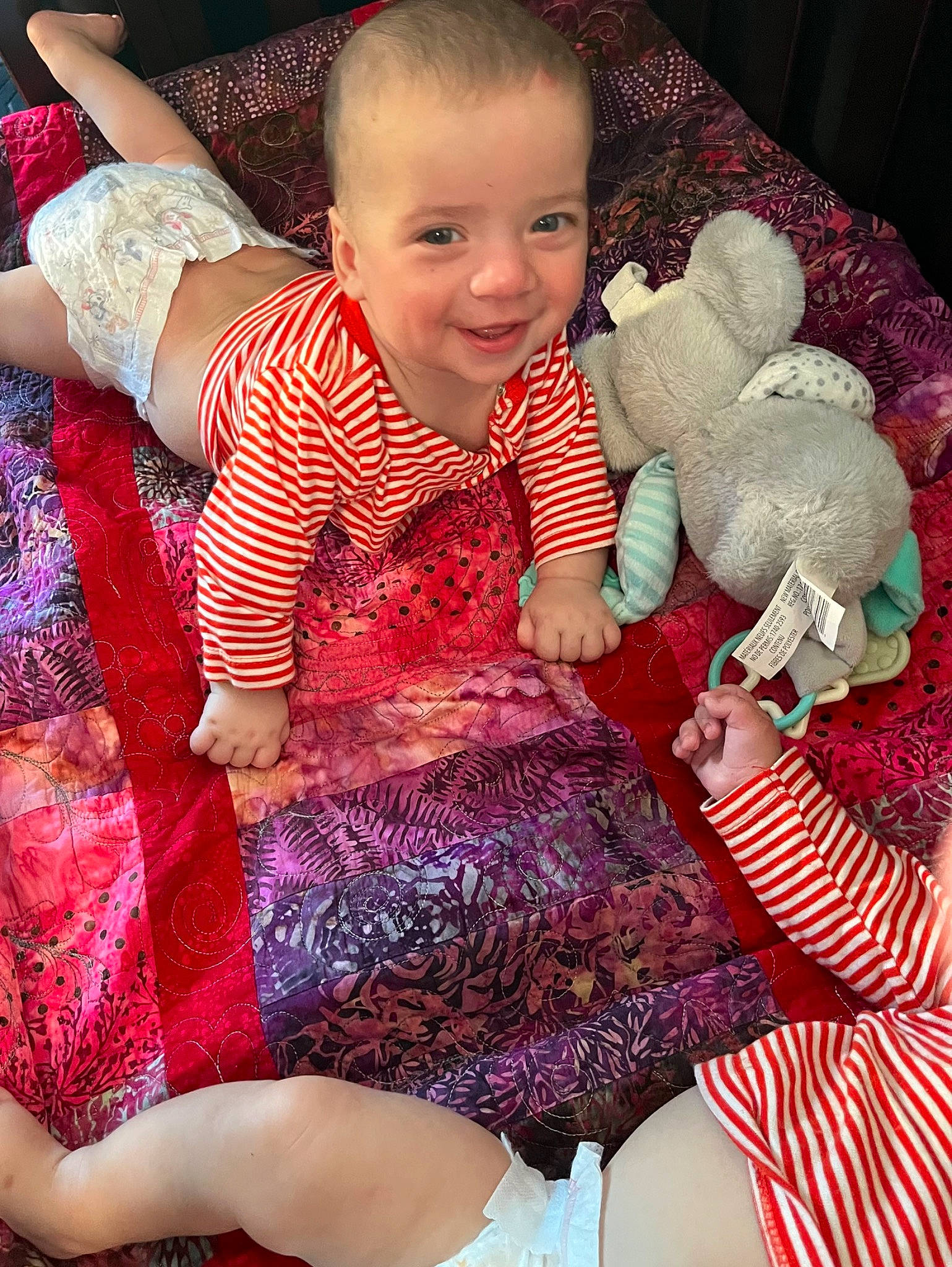 Max joined the competition — help win amazing prizes! abdomen, baby, baby_products, baby_toddler_clothing, child, fun, happy, human_leg, joy, lap, magenta, organ, pattern, person, pink, purple, skin, smile, textile, thigh