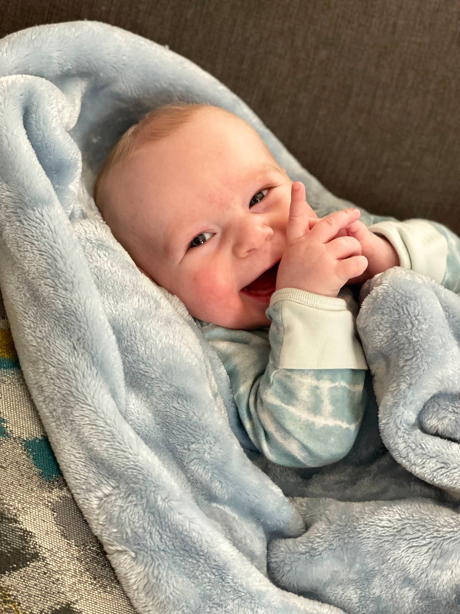 Elijah is registered to the contest to win money with this photo: baby, baby_sleeping, baby_toddler_clothing, cheek, child, comfort, facial_expression, fur, gesture, grass, happy, headgear, linens, lip, mammal, nose, person, skin, smile, thumb