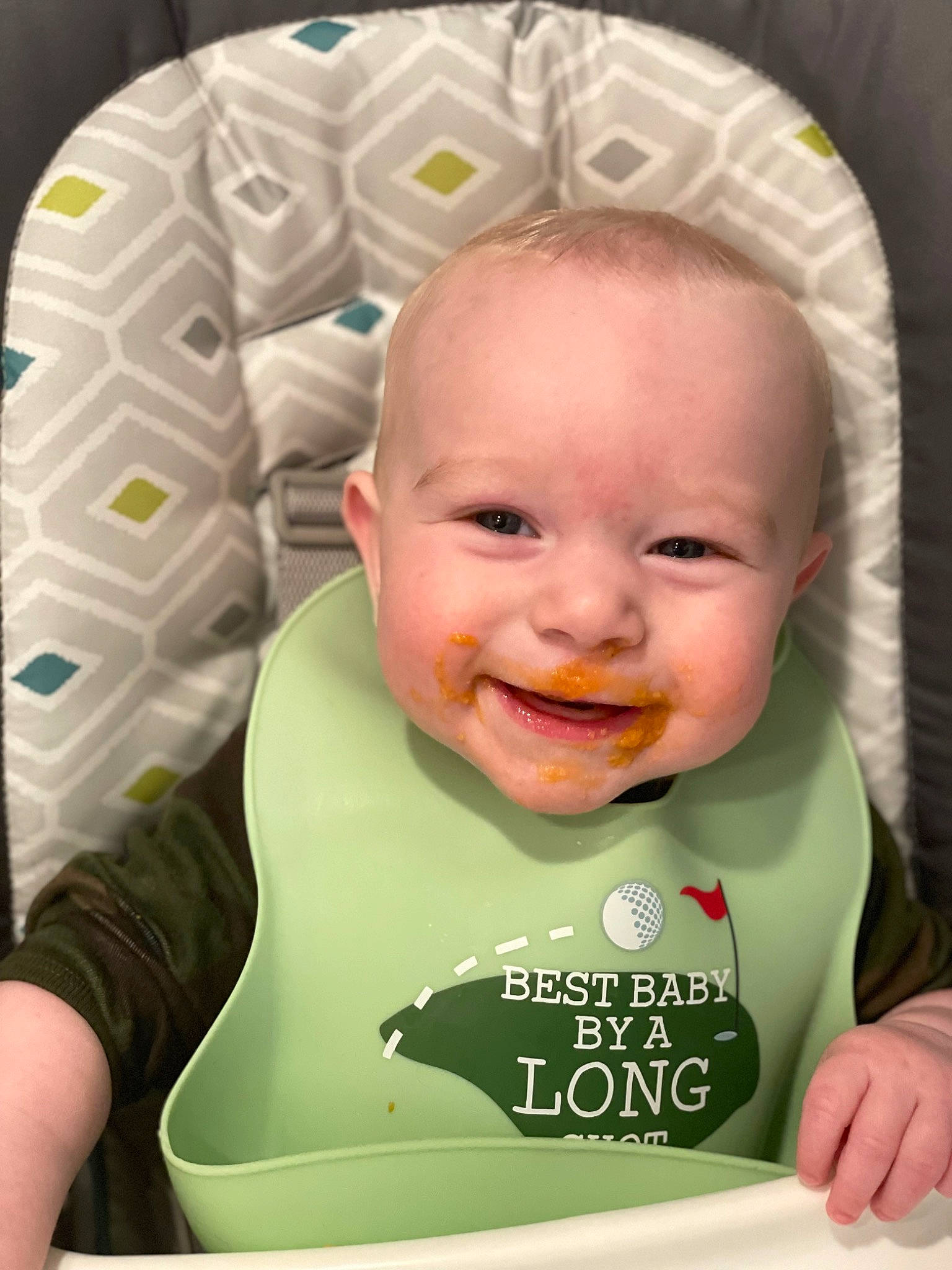 Elijah is registered to the contest to win money with this photo: baby, baby_toddler_clothing, bib, cheek, child, chin, eyebrow, face, green, happy, head, iris, joy, mouth, nose, organ, person, product, skin, sleeve