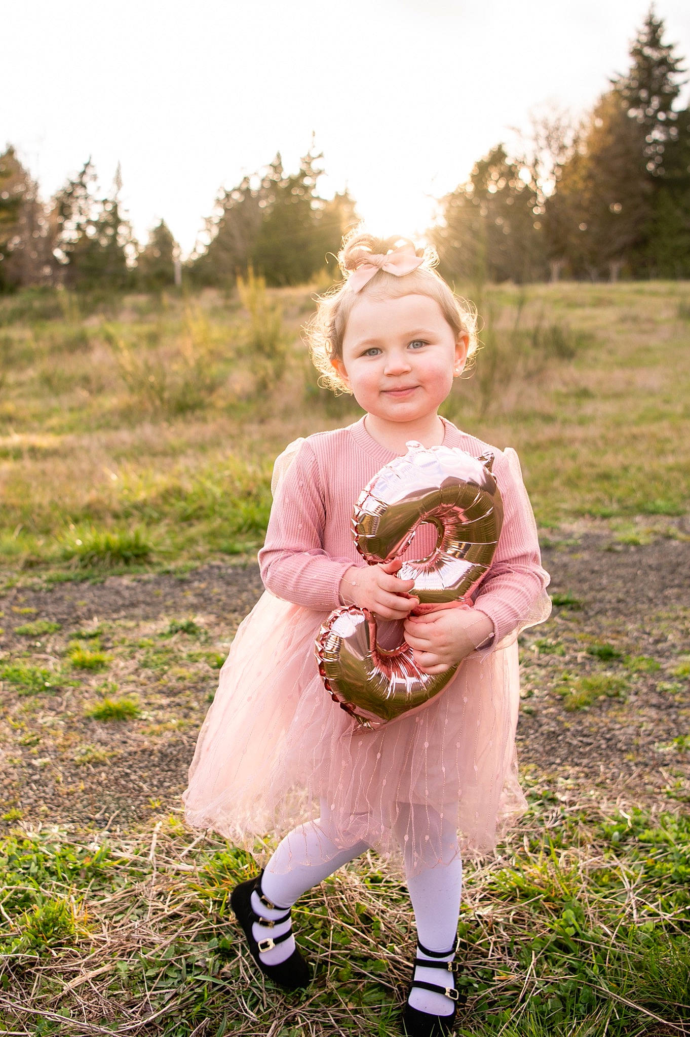 Adelyn is registered to the contest to win money with this photo: baby, baby_toddler_clothing, blond, dress, facial_expression, flash_photography, fun, grass, grassland, happy, joy, meadow, people_in_nature, person, pink, plant, prairie, sky, smile, sunlight