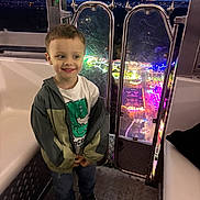 Artem a rejoint le concours — aidez-le/la à gagner de superbes lots ! child, boy, smiling, jacket, tshirt, jeans, sneakers, ferris_wheel, amusement_park, night, lights, glass, metal, cabin, playful, happy, standing, scratched, background, portrait